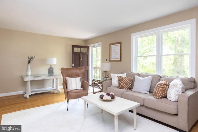 7012 Lancaster Rd, Baltimore, MD 21207 - living room featuring wood finished floors and baseboards
