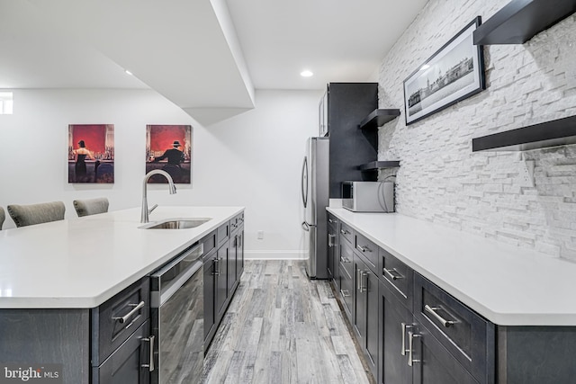 24642 Black Willow Dr, Aldie, VA 20105 - kitchen with a sink, open shelves, light countertops, and appliances with stainless steel finishes