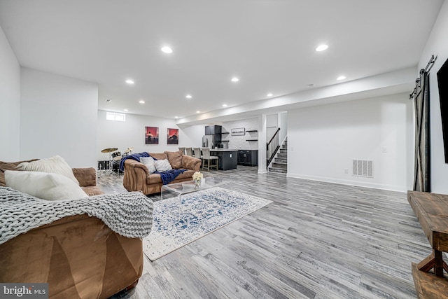 24642 Black Willow Dr, Aldie, VA 20105 - living room featuring baseboards, recessed lighting, stairs, visible vents, and wood finished floors