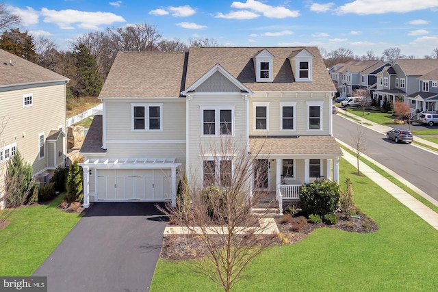 24642 Black Willow Dr, Aldie, VA 20105 - view of front facade featuring a front yard, a shingled roof, a porch, a residential view, and driveway