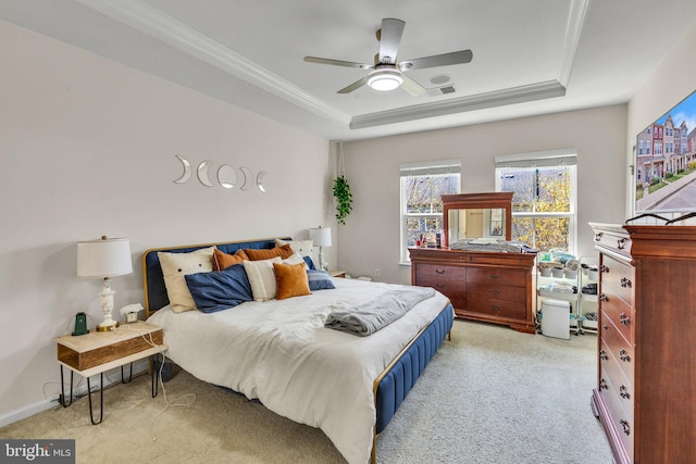 521 White Oak Dr, Glen Burnie, MD 21060 - bedroom featuring a tray ceiling, light carpet, crown molding, and visible vents