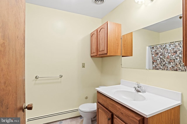 bathroom featuring vanity, a baseboard radiator, visible vents, and toilet