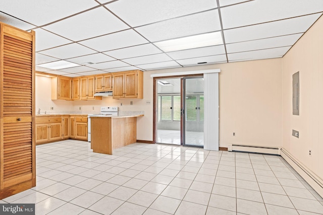 kitchen featuring electric range, under cabinet range hood, light countertops, and a drop ceiling