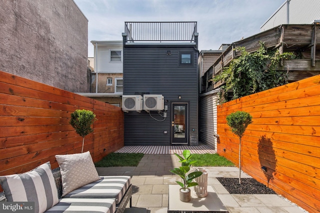 1129 E Berks St, Philadelphia, PA 19125 - rear view of house with a patio, fence, and ac unit