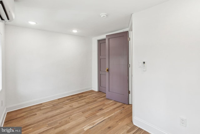 1129 E Berks St, Philadelphia, PA 19125 - unfurnished room with light wood-style flooring, a wall mounted AC, baseboards, and recessed lighting