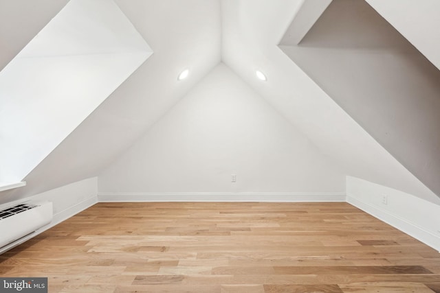 1129 E Berks St, Philadelphia, PA 19125 - additional living space with light wood finished floors, baseboards, vaulted ceiling, and a baseboard heating unit