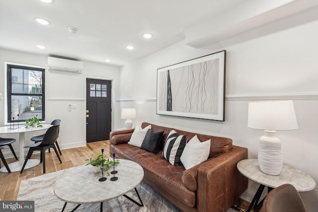 1129 E Berks St, Philadelphia, PA 19125 - living area featuring light wood-style flooring, an AC wall unit, baseboards, and recessed lighting