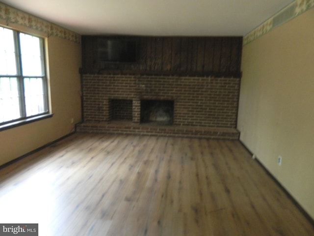 134 Country Ln, Sicklerville, NJ 08081 - unfurnished living room featuring wood finished floors and a fireplace