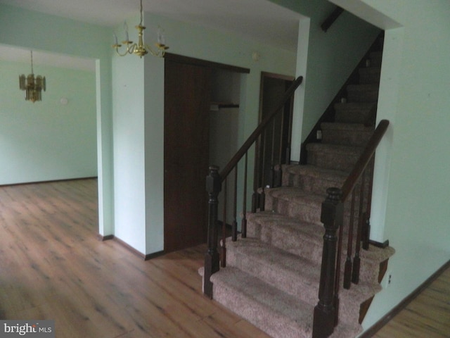 134 Country Ln, Sicklerville, NJ 08081 - staircase with a chandelier and wood finished floors