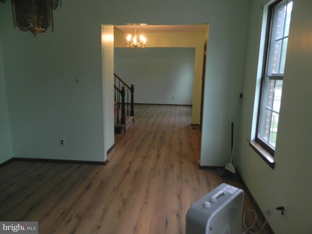 134 Country Ln, Sicklerville, NJ 08081 - unfurnished room featuring a chandelier, wood finished floors, stairs, and baseboards
