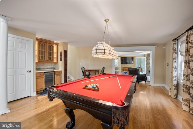 game room featuring light wood-style flooring, billiards, and wine cooler