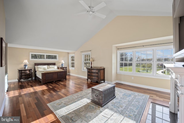 bedroom featuring wood finished floors, high vaulted ceiling, and baseboards