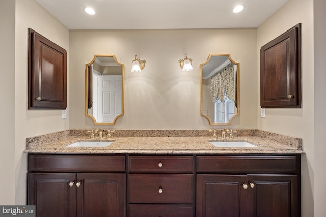 bathroom with double vanity and a sink