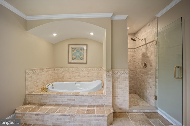 full bathroom featuring crown molding, a bath, and a stall shower
