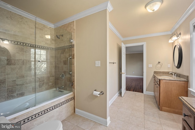 bathroom featuring tile patterned floors, vanity, baseboards, and crown molding