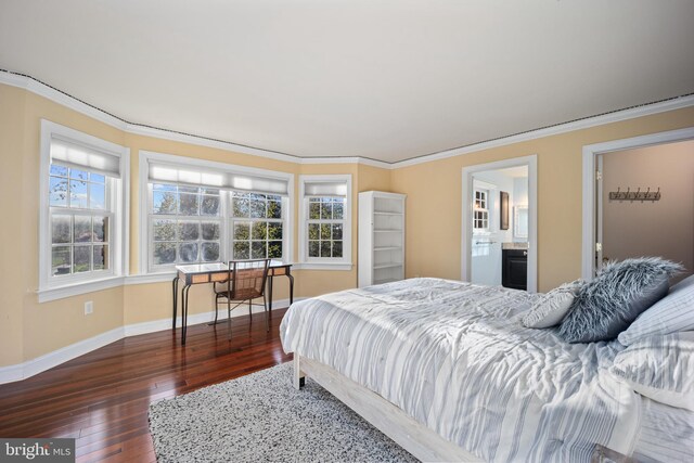 bedroom with hardwood / wood-style flooring, baseboards, and ornamental molding