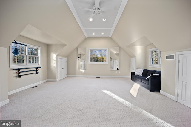 bonus room with baseboards, vaulted ceiling, carpet flooring, a ceiling fan, and visible vents