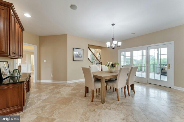 18102 Eaglesham Ct, Leesburg, VA 20175 - dining area with a chandelier, baseboards, and stairs