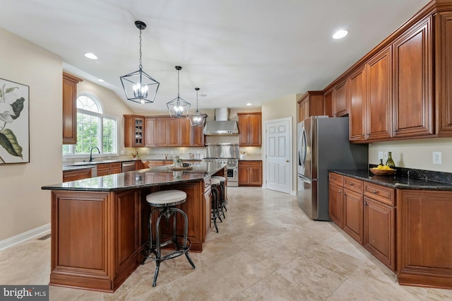 18102 Eaglesham Ct, Leesburg, VA 20175 - kitchen featuring wall chimney range hood, brown cabinetry, a breakfast bar, decorative backsplash, and stainless steel appliances