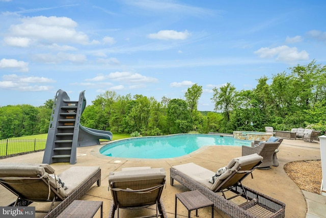 18102 Eaglesham Ct, Leesburg, VA 20175 - view of pool with a water slide, a patio, an outdoor hangout area, fence, and a pool with connected hot tub