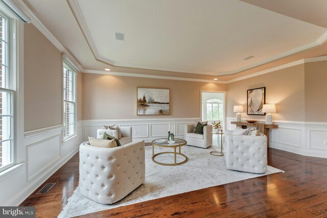 18102 Eaglesham Ct, Leesburg, VA 20175 - living area with hardwood / wood-style flooring, healthy amount of natural light, a wainscoted wall, crown molding, and a decorative wall