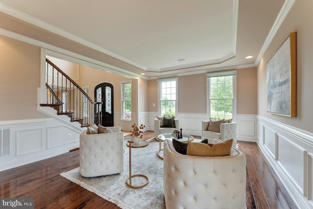 18102 Eaglesham Ct, Leesburg, VA 20175 - living area featuring arched walkways, stairs, hardwood / wood-style floors, wainscoting, and ornamental molding