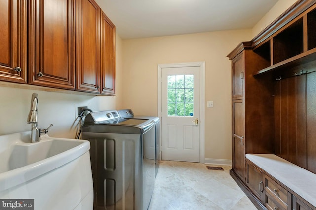 18102 Eaglesham Ct, Leesburg, VA 20175 - washroom with cabinet space and washer and clothes dryer