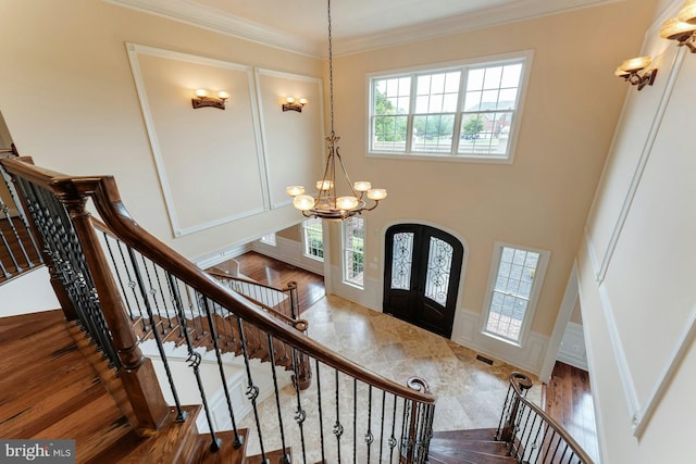 18102 Eaglesham Ct, Leesburg, VA 20175 - entrance foyer with a chandelier, stairway, french doors, crown molding, and wood finished floors