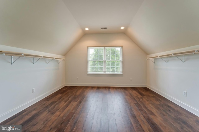18102 Eaglesham Ct, Leesburg, VA 20175 - spacious closet featuring dark wood-type flooring and vaulted ceiling