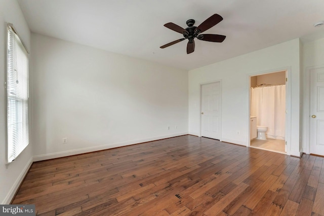 18102 Eaglesham Ct, Leesburg, VA 20175 - unfurnished bedroom featuring dark wood-type flooring, baseboards, and connected bathroom