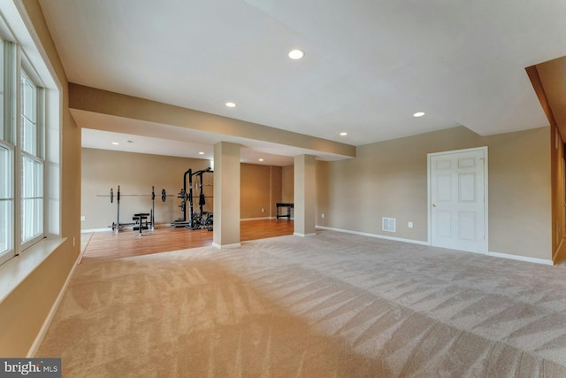18102 Eaglesham Ct, Leesburg, VA 20175 - unfurnished living room with light colored carpet, baseboards, and recessed lighting