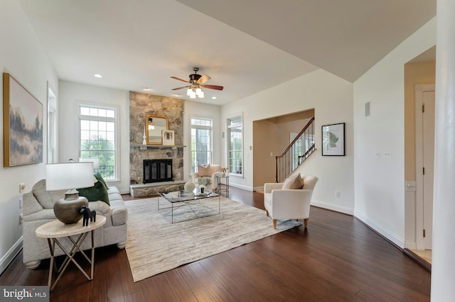 18102 Eaglesham Ct, Leesburg, VA 20175 - living area featuring dark wood finished floors, stairs, a fireplace, baseboards, and a ceiling fan