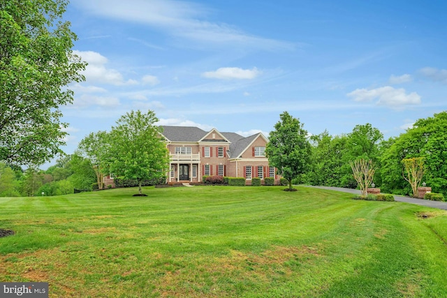 18102 Eaglesham Ct, Leesburg, VA 20175 - colonial inspired home featuring a front lawn, a balcony, and brick siding