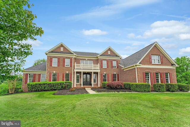 18102 Eaglesham Ct, Leesburg, VA 20175 - georgian-style home featuring brick siding, french doors, and a front lawn