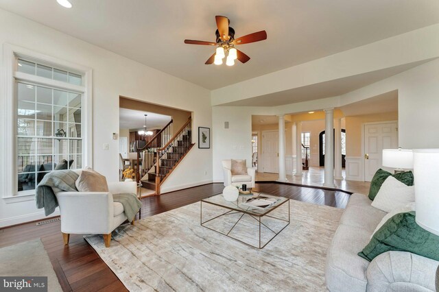 18102 Eaglesham Ct, Leesburg, VA 20175 - living area featuring decorative columns, stairs, wood finished floors, ceiling fan, and baseboards