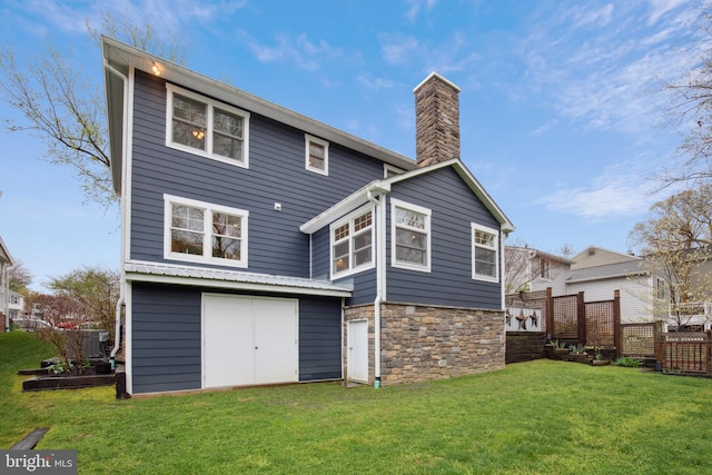810 Macsherry Dr, Arnold, MD 21012 - back of property with a yard, stone siding, a chimney, fence, and an outdoor structure