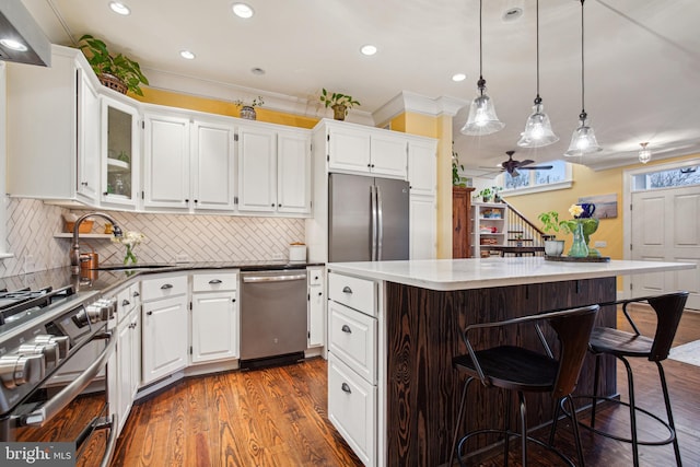 810 Macsherry Dr, Arnold, MD 21012 - kitchen featuring white cabinets, dark wood finished floors, stainless steel appliances, a sink, and ceiling fan