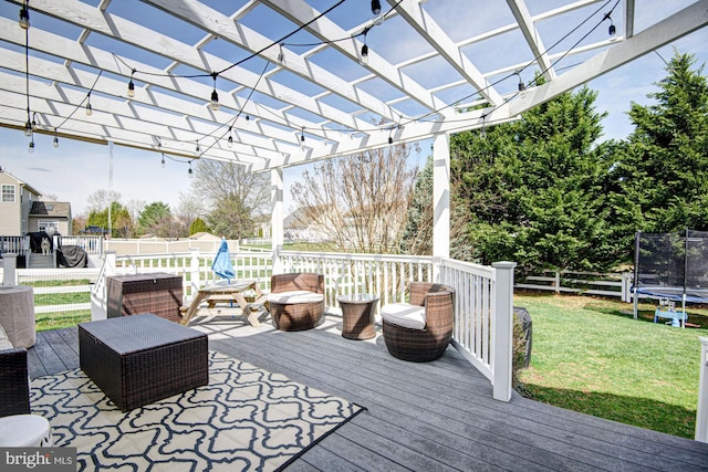 24 W Shakespeare Dr, Middletown, DE 19709 - wooden deck featuring a trampoline and a pergola