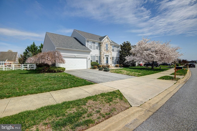 24 W Shakespeare Dr, Middletown, DE 19709 - view of side of property with asphalt driveway, a garage, and a shingled roof