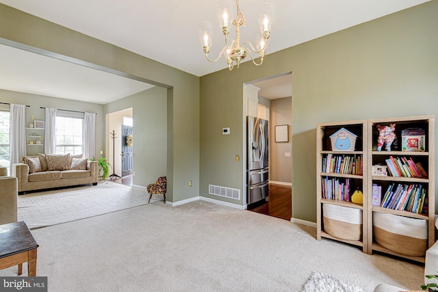24 W Shakespeare Dr, Middletown, DE 19709 - sitting room with carpet floors, a chandelier, and baseboards