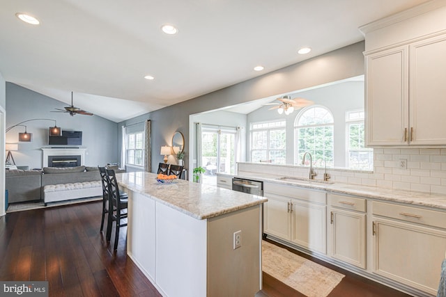 24 W Shakespeare Dr, Middletown, DE 19709 - kitchen featuring ceiling fan, vaulted ceiling, a sink, open floor plan, and a center island