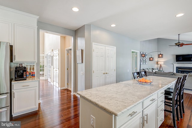 24 W Shakespeare Dr, Middletown, DE 19709 - kitchen with freestanding refrigerator, ceiling fan, open floor plan, dark wood-type flooring, and recessed lighting