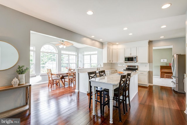 24 W Shakespeare Dr, Middletown, DE 19709 - dining area with dark wood-style flooring, recessed lighting, a ceiling fan, and baseboards