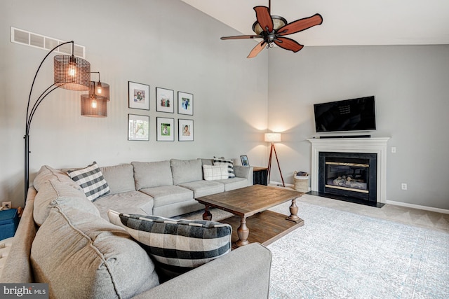 24 W Shakespeare Dr, Middletown, DE 19709 - carpeted living area with ceiling fan, a fireplace, high vaulted ceiling, and baseboards