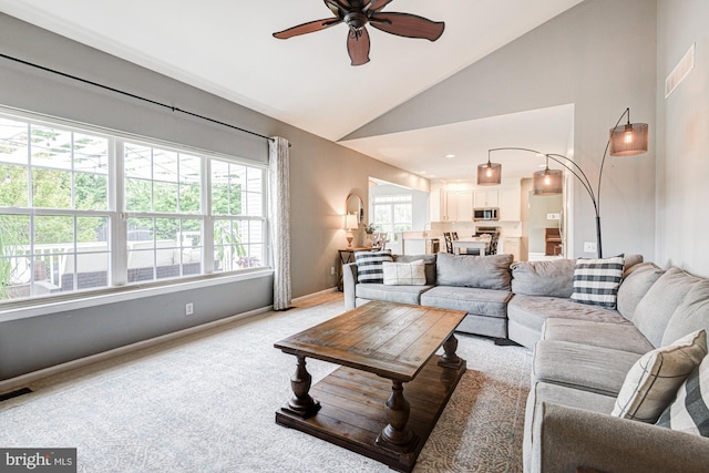 24 W Shakespeare Dr, Middletown, DE 19709 - living room featuring a ceiling fan, lofted ceiling, baseboards, and light colored carpet