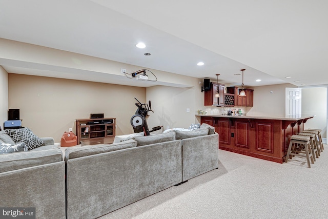 24 W Shakespeare Dr, Middletown, DE 19709 - living area featuring bar with sink, recessed lighting, and light carpet