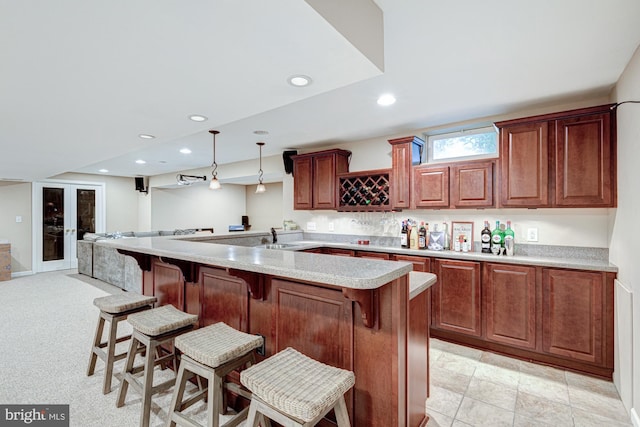 24 W Shakespeare Dr, Middletown, DE 19709 - kitchen with a breakfast bar area, light countertops, open floor plan, pendant lighting, and recessed lighting