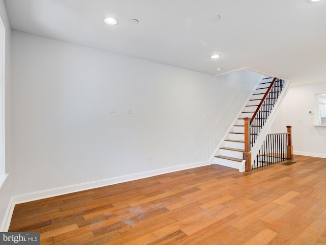 2671 Emerald St, Philadelphia, PA 19125 - basement featuring recessed lighting, light wood-style flooring, baseboards, and stairway