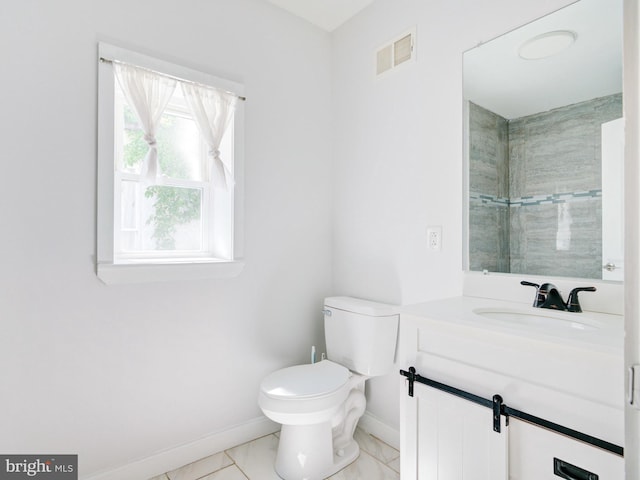 2671 Emerald St, Philadelphia, PA 19125 - full bath featuring visible vents, baseboards, vanity, toilet, and marble finish floor