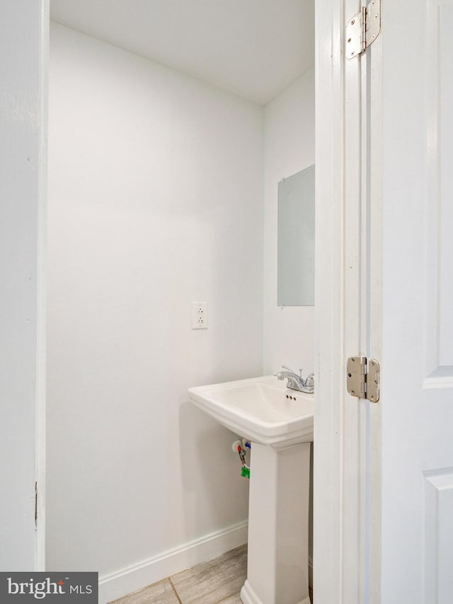 2671 Emerald St, Philadelphia, PA 19125 - bathroom featuring baseboards and wood finished floors
